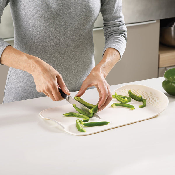 2229 chop drain vegetables fruits chopping board sleek knife